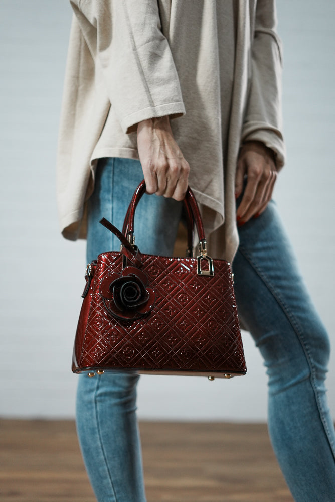 Embossed blossom print leather handbag | Runway Secrets
