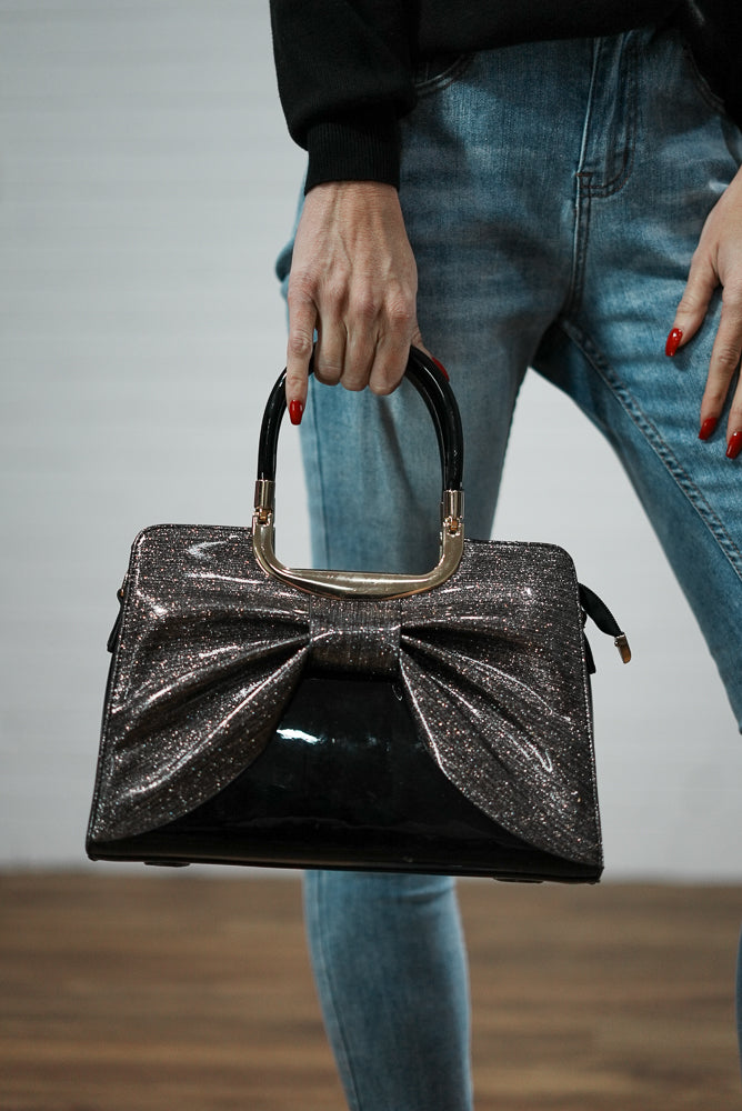 Faux leather shimmer bow handbag | Runway Secrets