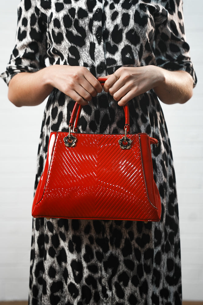 Red embossed leather handbag | Runway Secrets