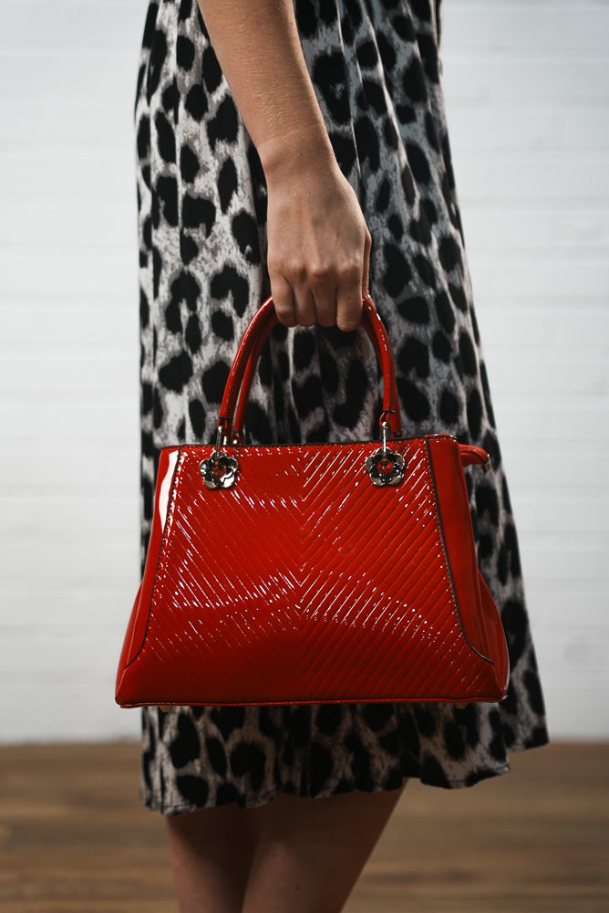 Red embossed leather handbag | Runway Secrets