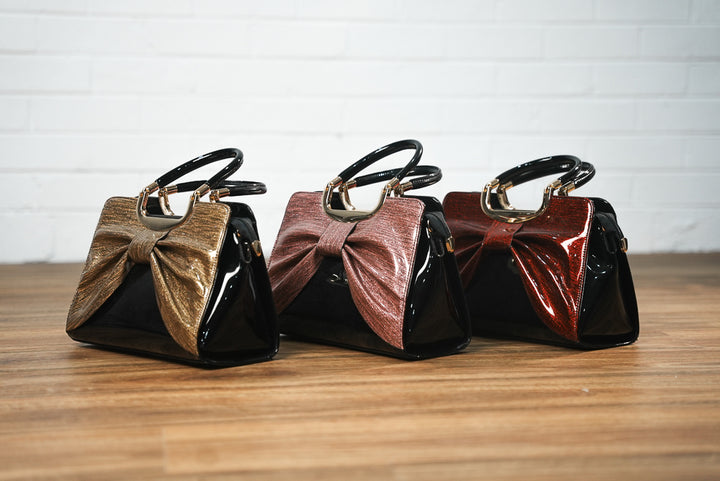 Faux leather shimmer bow handbag | Runway Secrets