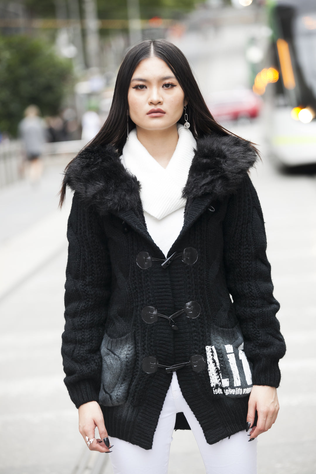 Black knitted jacket with faux fur hood | Runway Secrets