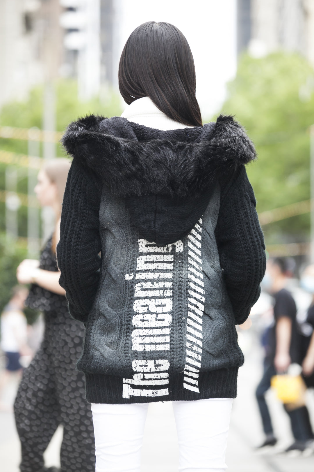 Black knitted jacket with faux fur hood | Runway Secrets